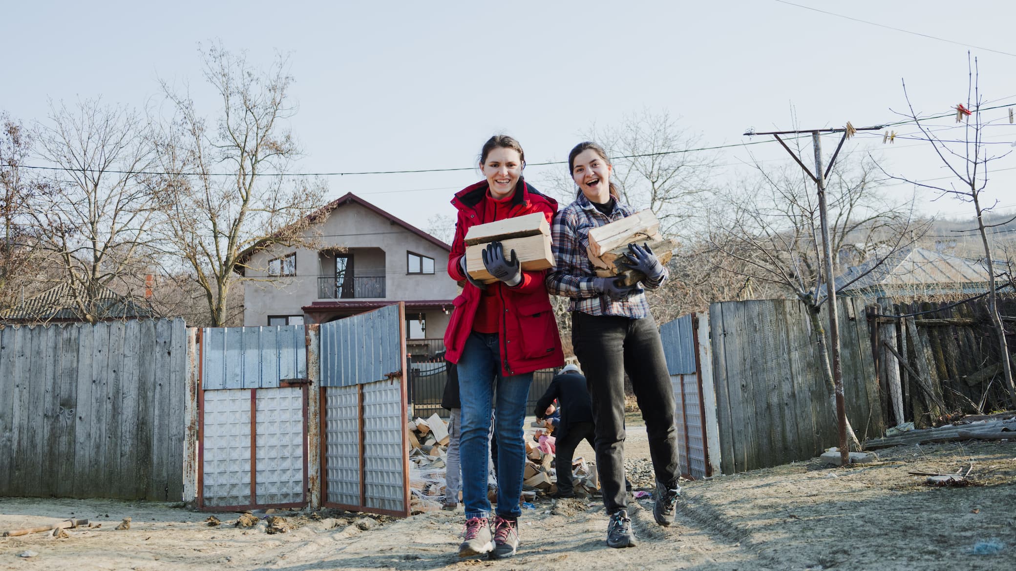 Humanitarian aid team delivering firewood